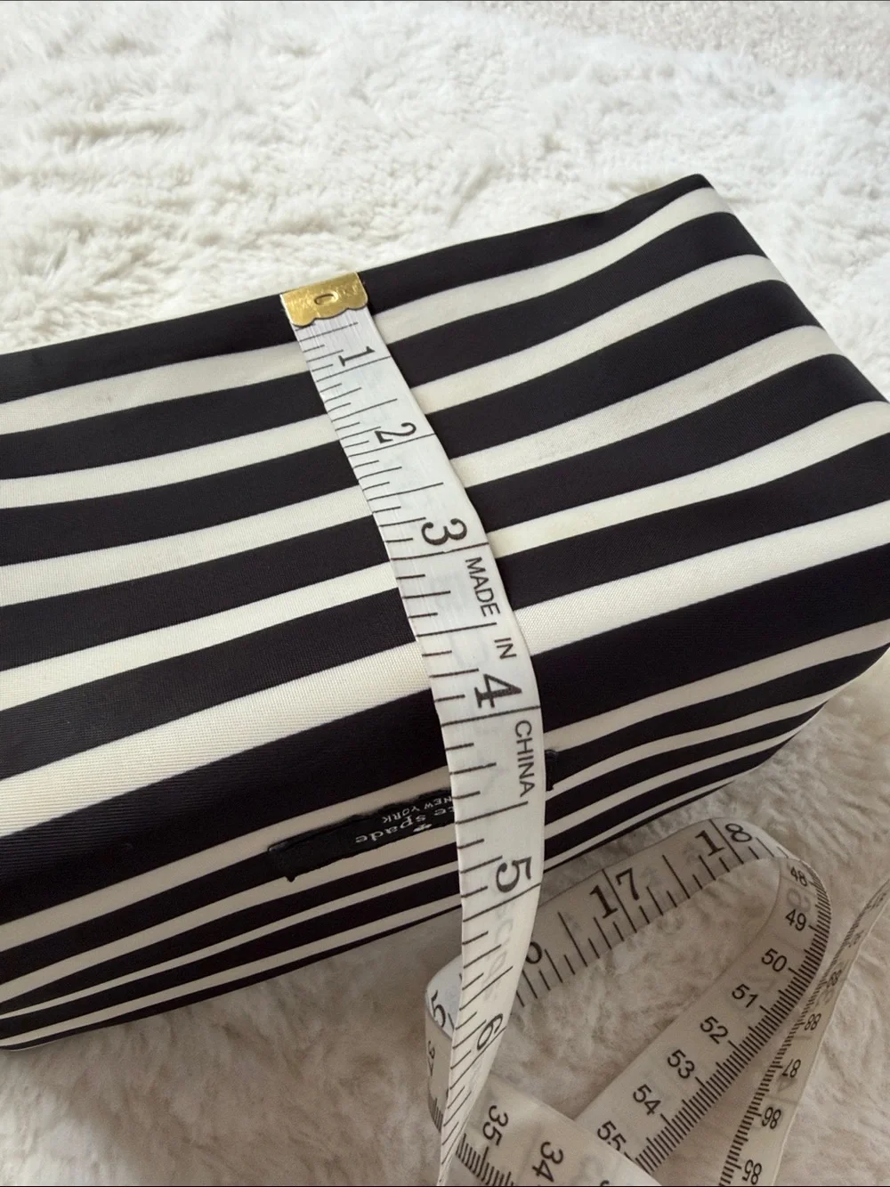 KATE SPADE,  black and white striped makeup pouch